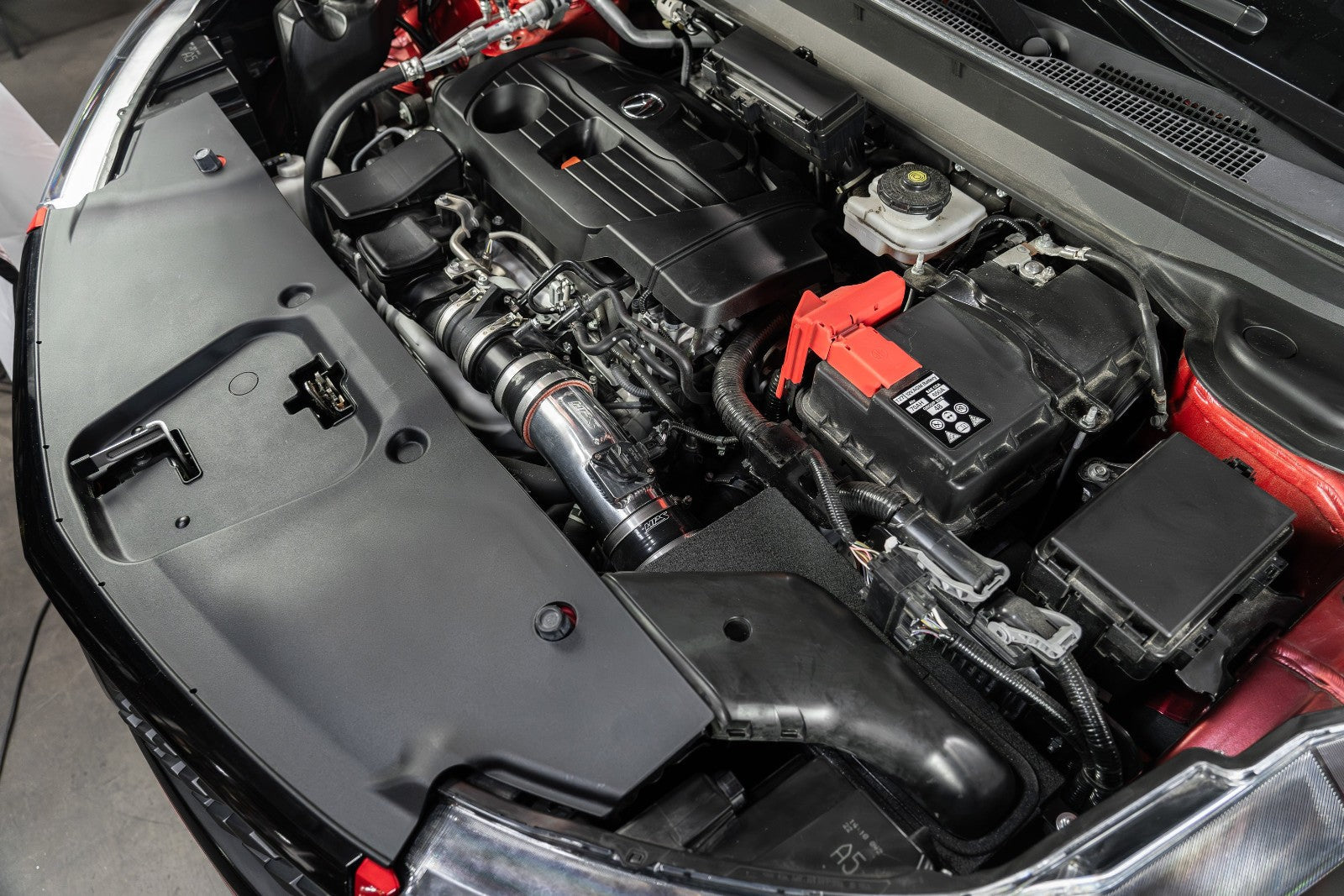 HPS Shortram Air Intake Heat Shield Kit for 19+ Acura RDX 2.0L Turbo TC1 / TC2 SKU 827-729P, polished alternate installed engine bay view