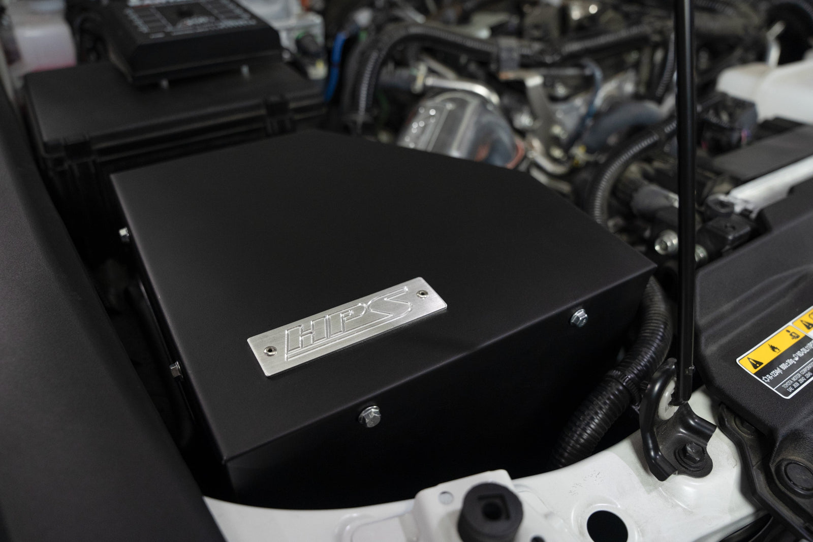 HPS Shortram Air Intake Heat Shield Kit for 24-26 Toyota Land Cruiser 2.4L Turbo J250 SKU 827-786P, polished installed engine bay view 3